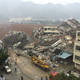 Rescuers search for survivors in damaged buildings on Dec. 20.